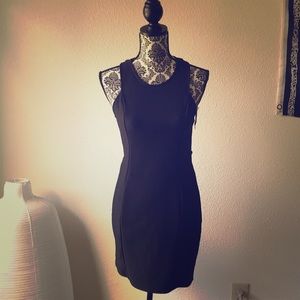 Fitted LBD with cutout rib caged back.